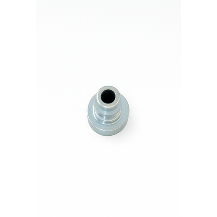 Metallic cylindrical object with a central hole on a white background